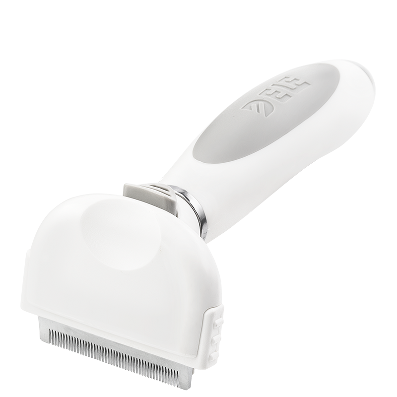 Dog and Cat Deshedding Brush Small white deshedding brush for dogs with fine metal teeth and ergonomic handle, to reduce shedding and remove loose fur.