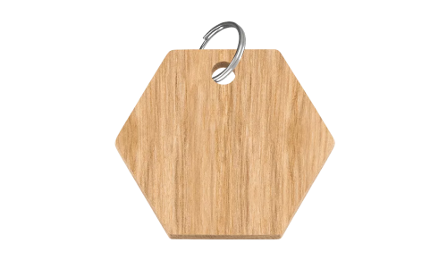 Wooden hexagon-shaped dog tag, 38mm x 25mm, FSC-certified wood, with a silver ring, customisable with personalised dog name.